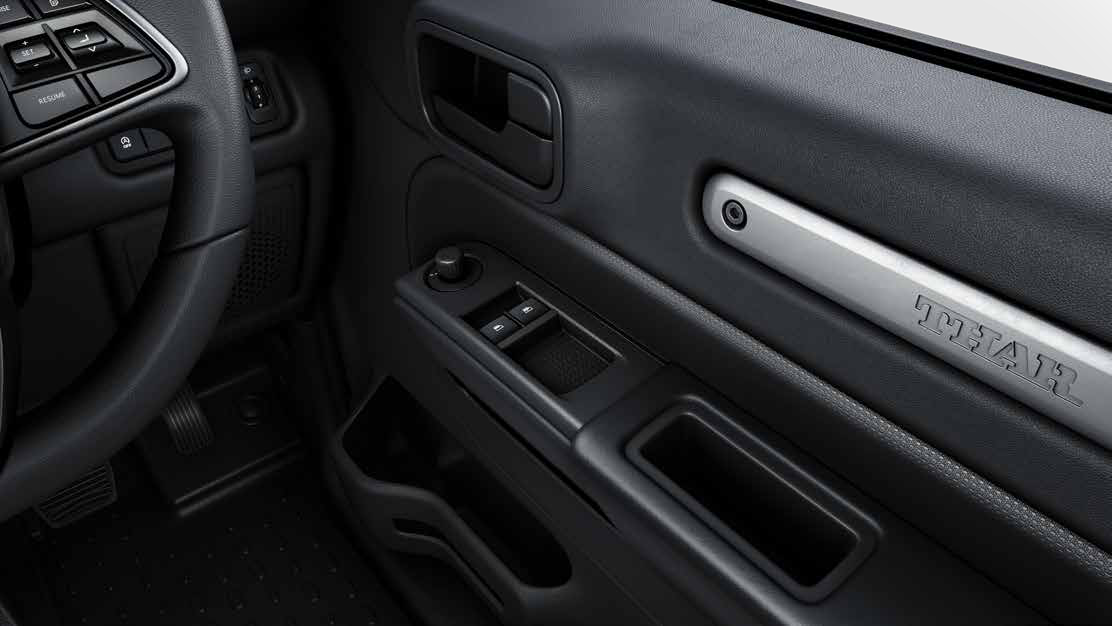 Mahindra Thar — One-touch power windows with switches on the door trim