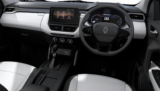 Renault Kiger interior showing steering wheel, digital dashboard, touchscreen, and white-black upholstery.