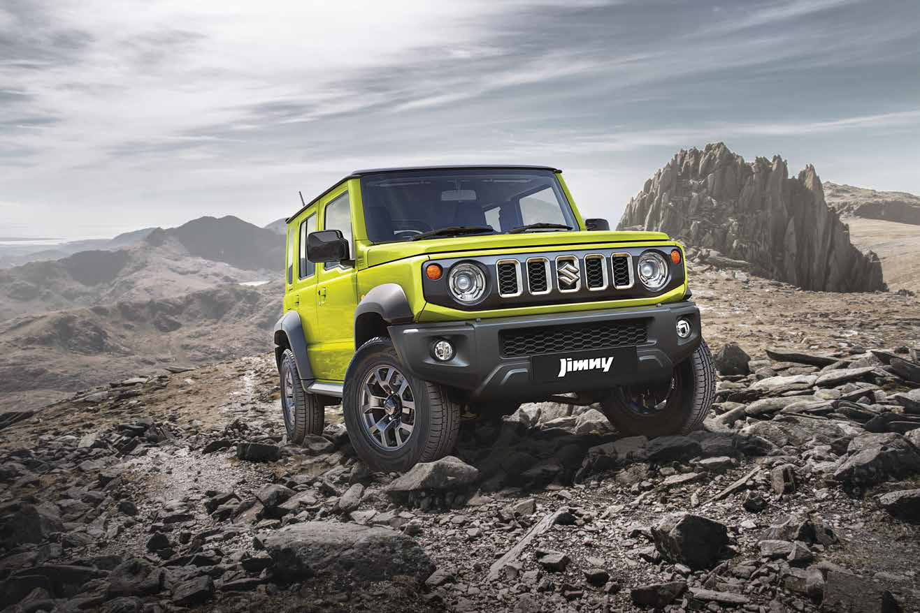 Maruti Suzuki Jimny — Boxy, upright front end with round LED headlamps and the signature five-slot Suzuki grille.