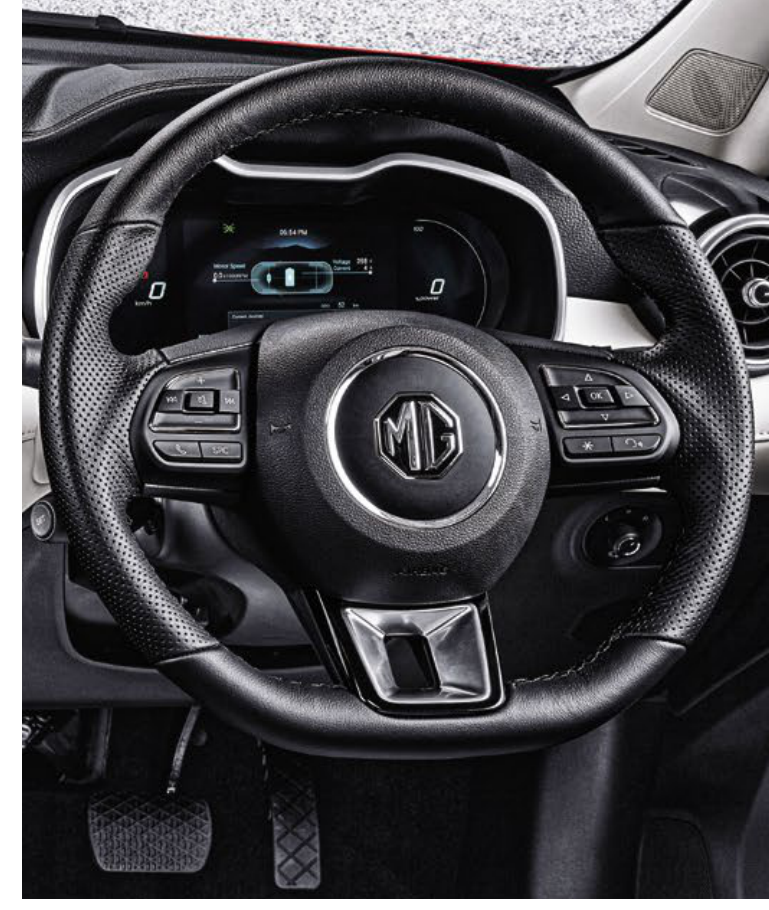 MG ZS EV — Leather-wrapped steering wheel with contrast stitching and mounted controls