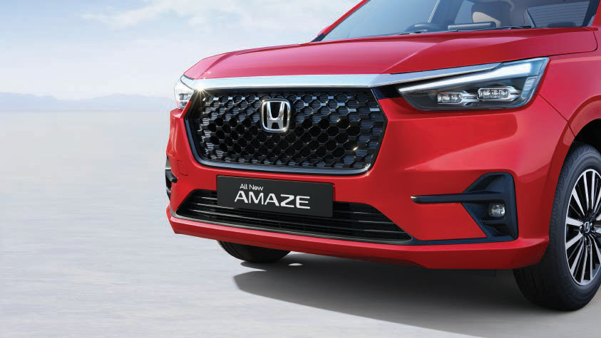 Honda Amaze — Signature chequered flag-pattern front grille with chrome upper moulding, flanked by LED projector headlamp