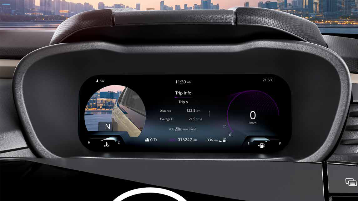 Tata Altroz — 26.03 cm Ultra View HD digital instrument cluster showing trip info and a camera feed for the blind spot monitor