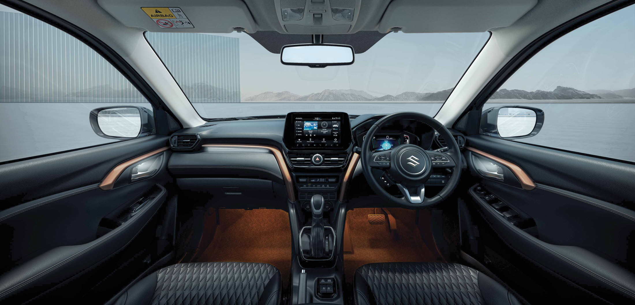 Maruti Suzuki Grand Vitara — Layered dashboard with a free-standing touchscreen, digital cluster and quilted upholstery.