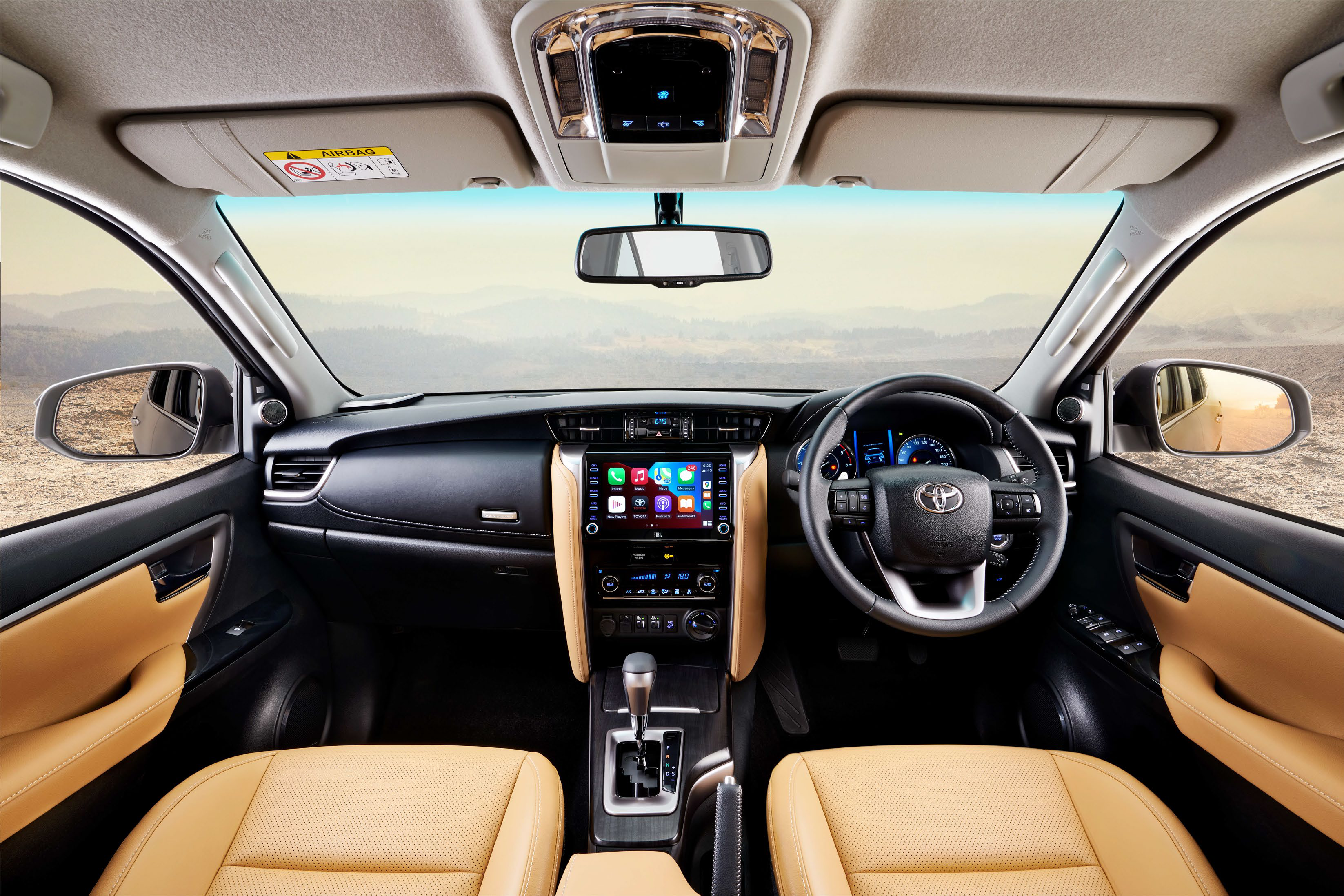 Toyota Fortuner — Dual-tone dashboard with tan leather and floating touchscreen infotainment