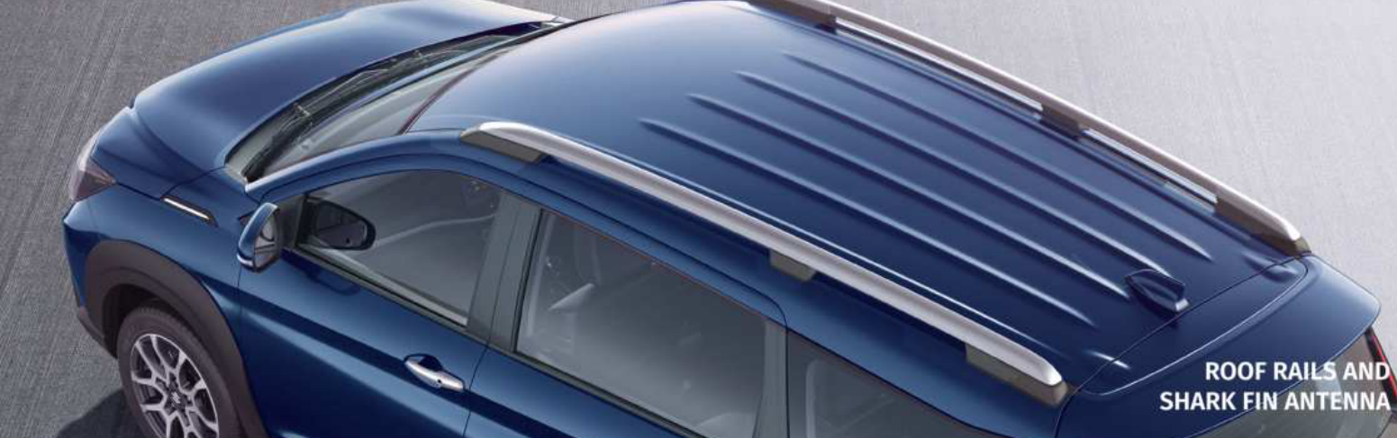 Maruti Suzuki XL6 — Silver roof rails paired with a shark-fin antenna