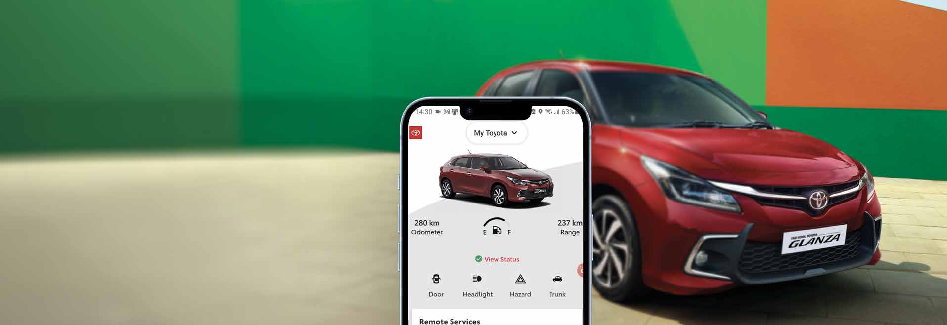 Toyota Glanza — My Toyota connected-car app shows odometer and range with remote door, headlight and hazard controls.