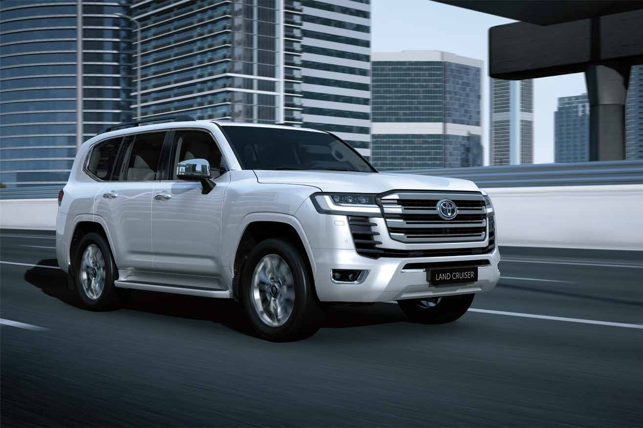 Toyota Land Cruiser — Bold front grille flanked by LED headlamps with integrated DRLs