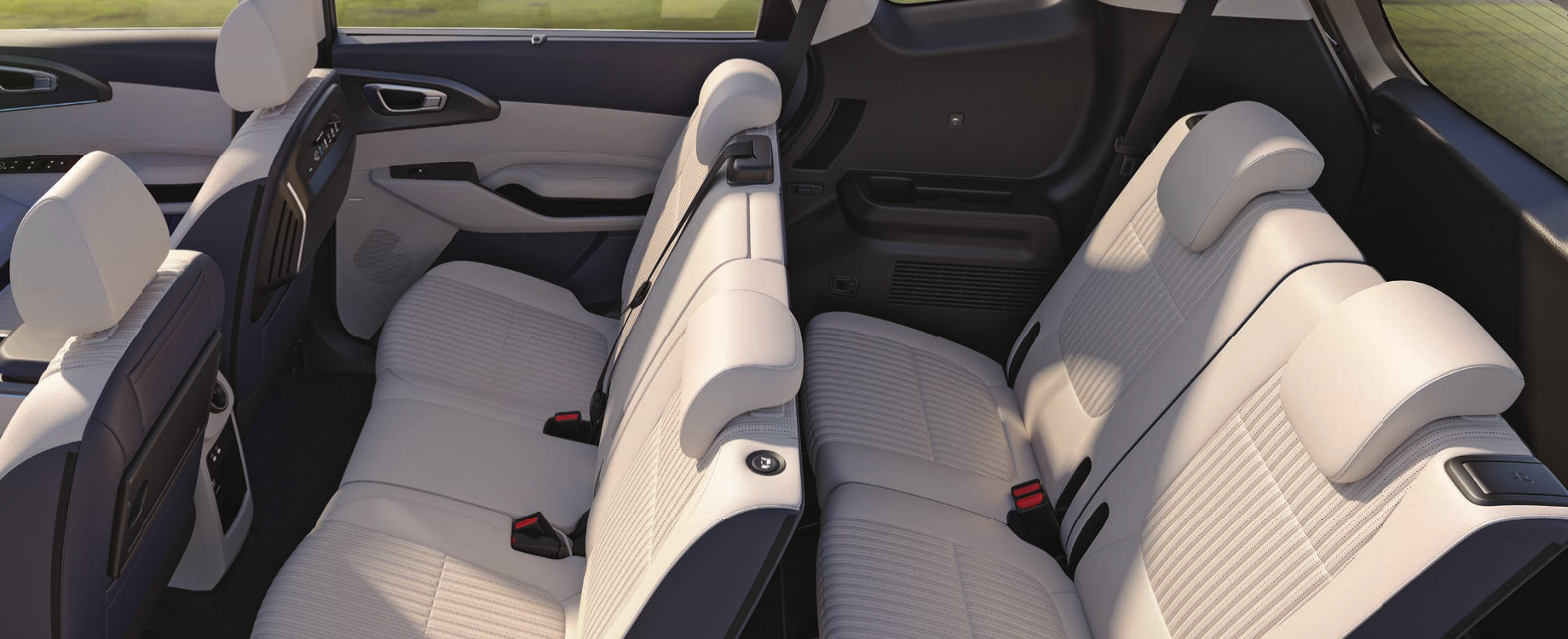 Kia Carens Clavis EV — Three-row cabin with light upholstery and 2nd & 3rd row bench seating