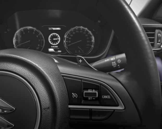 Maruti Suzuki Grand Vitara — Steering-mounted paddle shifters and cruise-control switches.