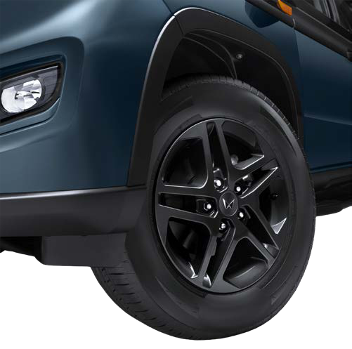 Mahindra Bolero Neo — R16 dark metallic grey alloy wheels with wheel-arch cladding