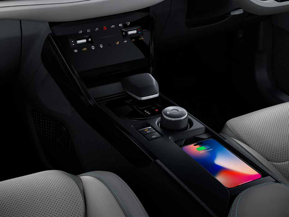 Tata Nexon EV — Grand centre console with drive-mode dial, wireless charging pad and storage