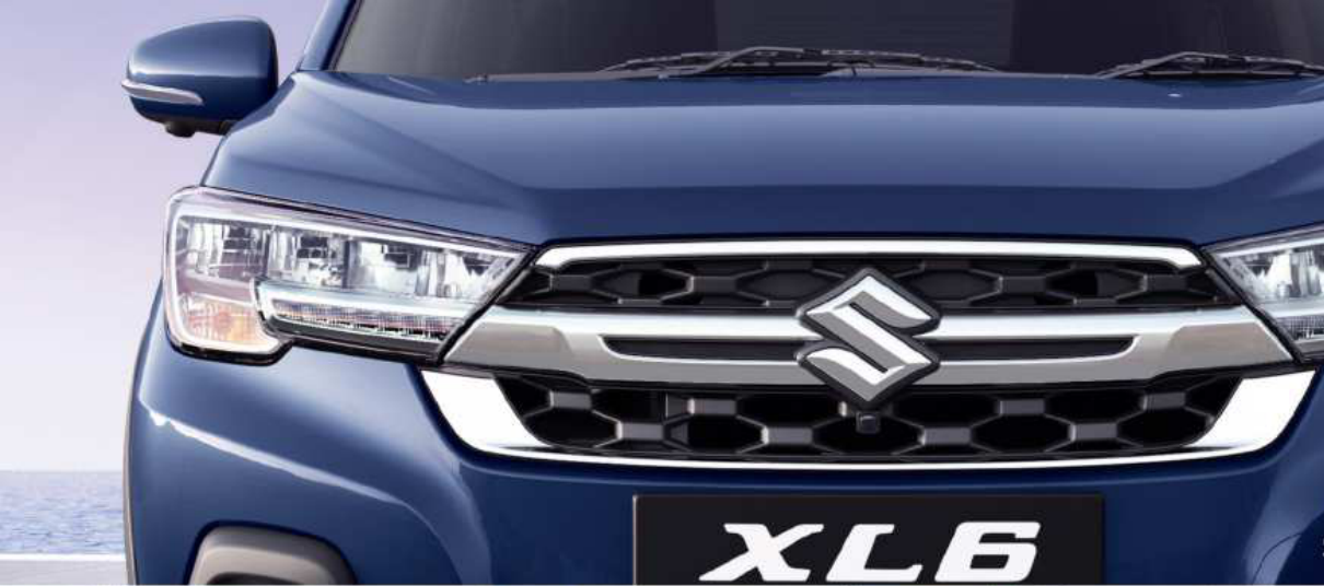 Maruti Suzuki XL6 — Bold front chrome grille with a sweeping X-bar element, flanked by quad-chamber LED headlamps