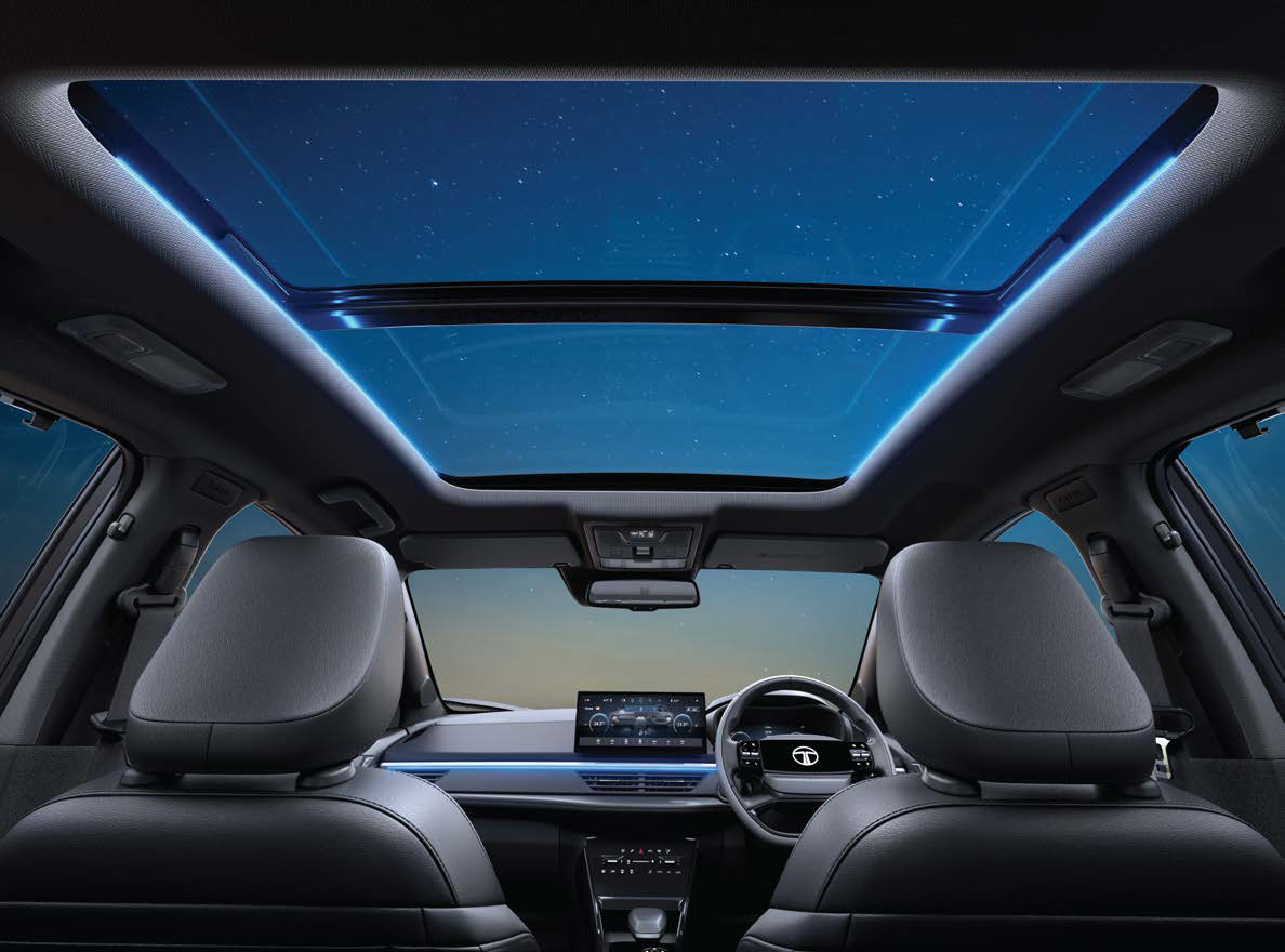 Tata Curvv — Voice-assisted panoramic sunroof with ambient mood lighting around the glass area.