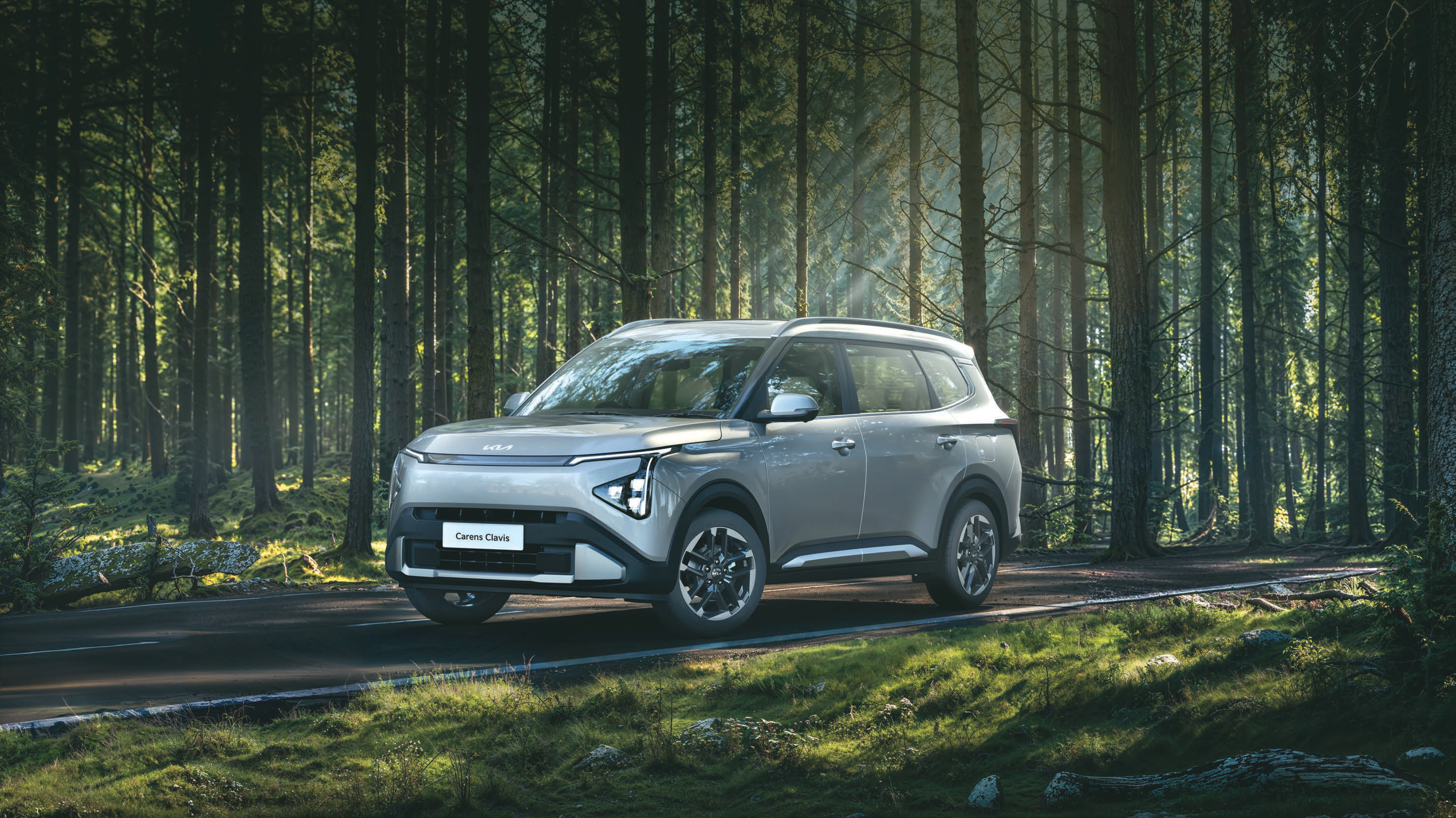 Kia Carens Clavis — Front three-quarter profile with the connected Star Map LED headlamp signature