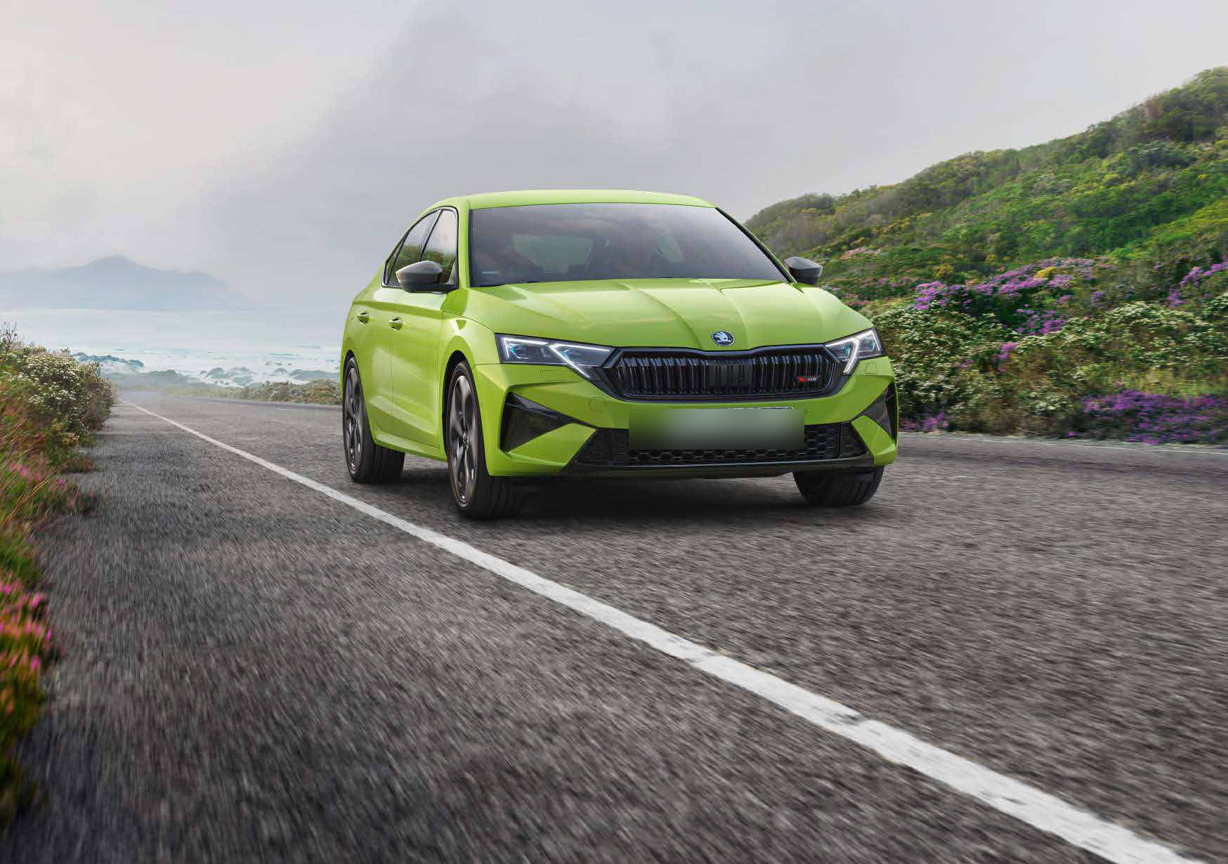 Skoda Octavia RS — Sporty front with full-LED Matrix headlights, a wide gloss-black grille and the RS badge.