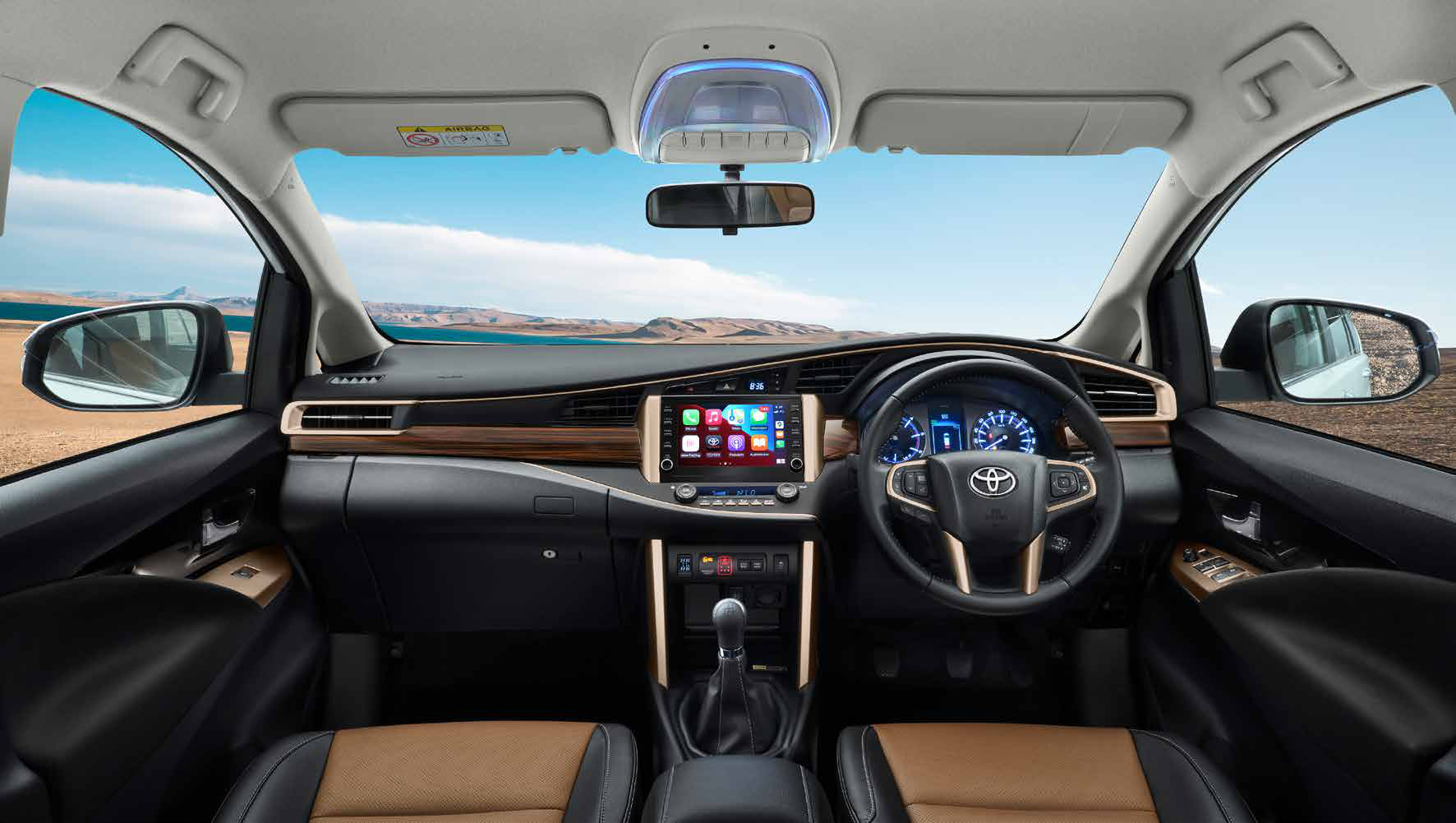 Toyota Innova Crysta — Dashboard with floating touchscreen infotainment and wood-finish trim