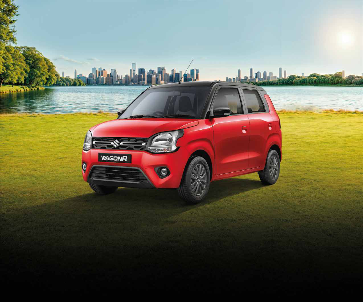 Maruti Suzuki Wagon R — Front three-quarter styling with a wide chrome-slat grille, swept-back headlamps and a dual-tone body with a contrast black roof.