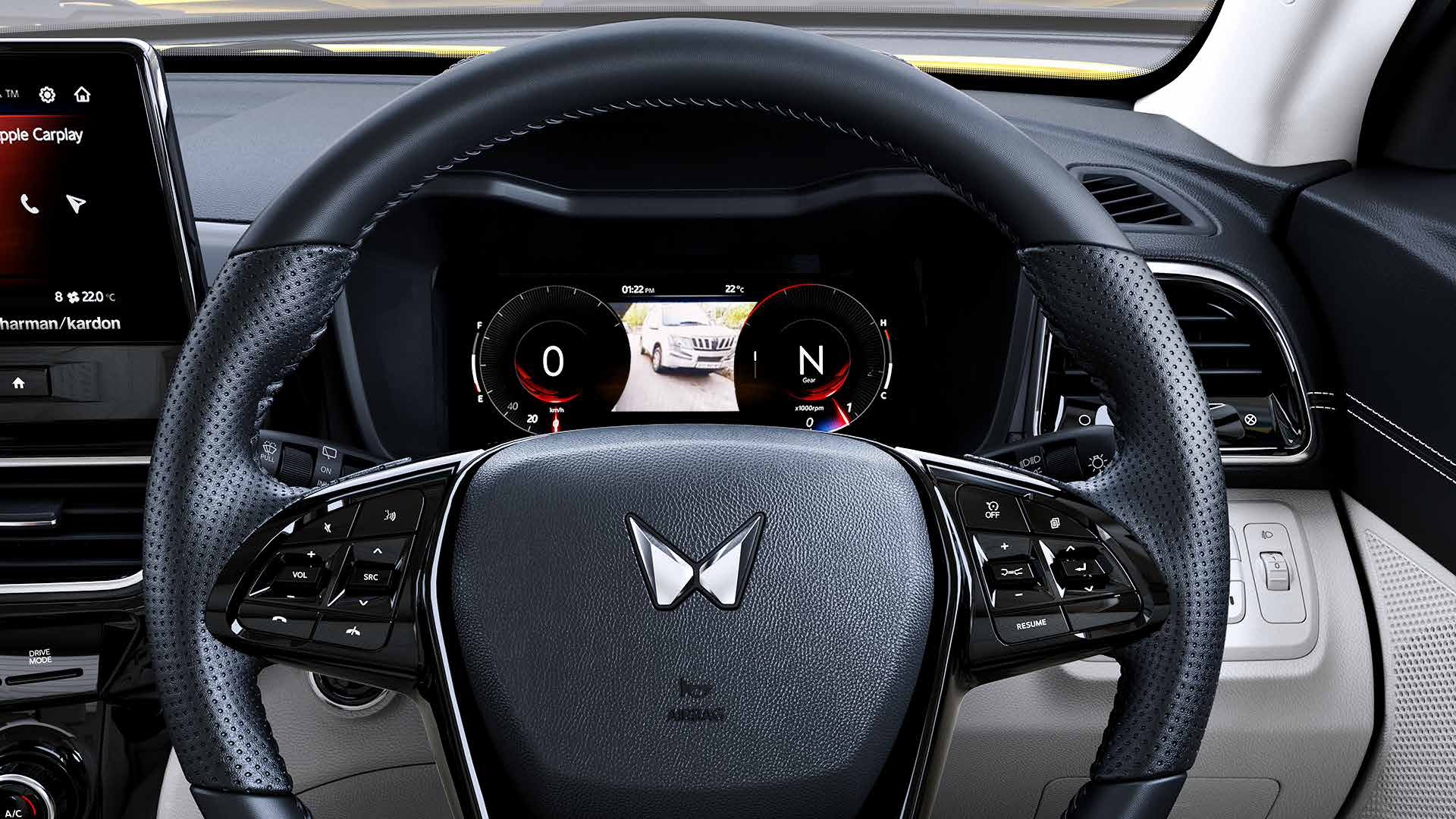 Mahindra XUV 3XO — Leather-wrapped steering wheel with mounted audio and cruise controls