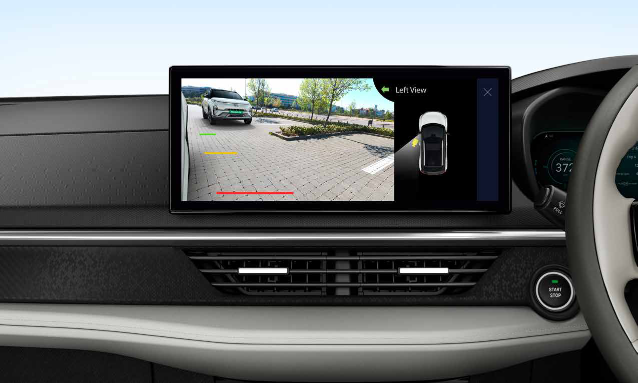 Tata Nexon EV — Blind Spot View Monitor shows the kerb-side camera feed on the touchscreen while indicating