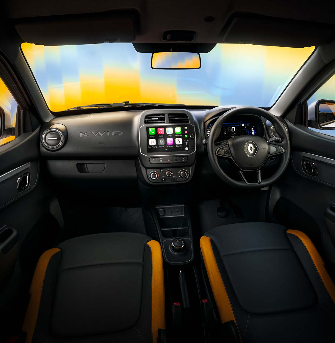 Renault Kwid — Dual-tone cabin with contrast orange seat bolsters, KWID-branded dashboard and a 20.32 cm touchscreen.