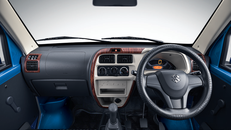 Maruti Suzuki Eeco — Interior styling kit with wood-finish dashboard inserts and steering wheel cover.
