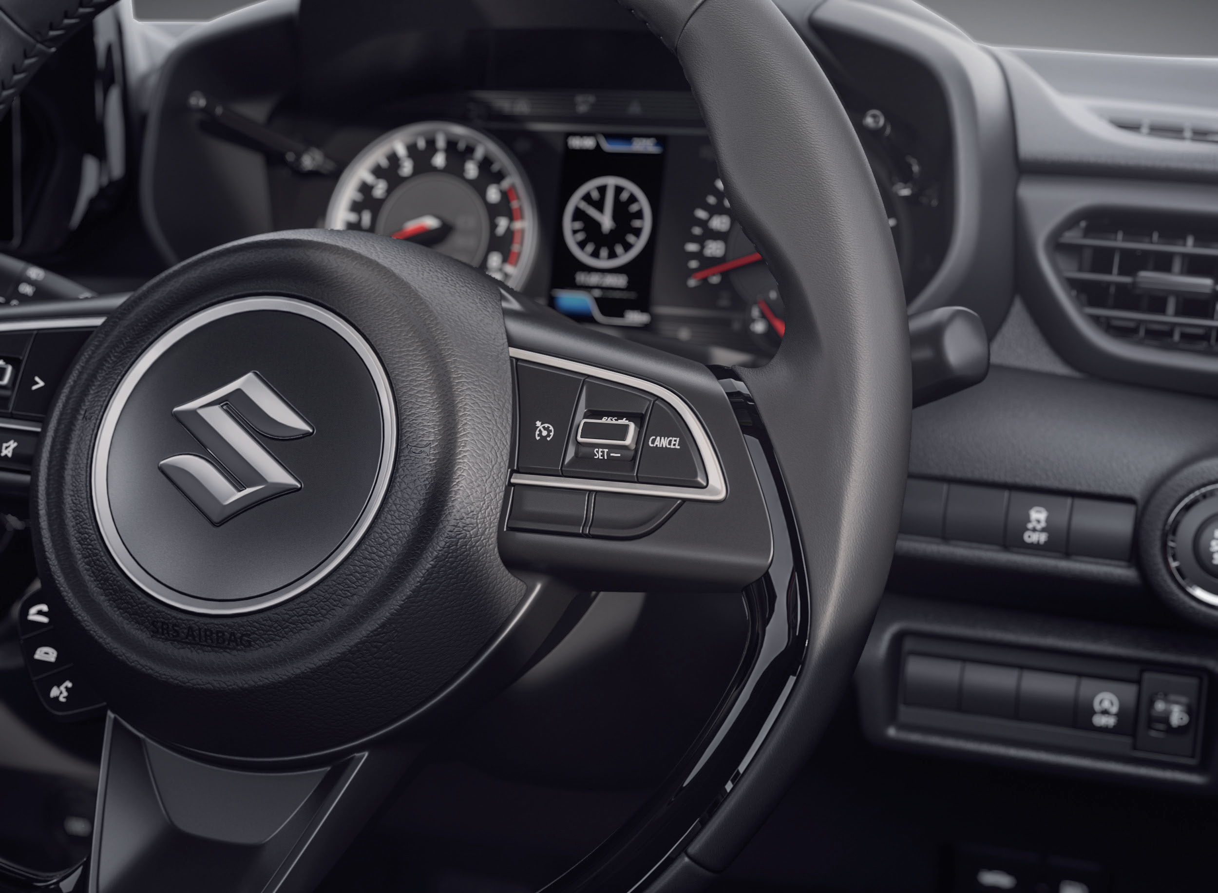 Maruti Suzuki Swift — Steering-mounted cruise control switches with SET, RES and CANCEL
