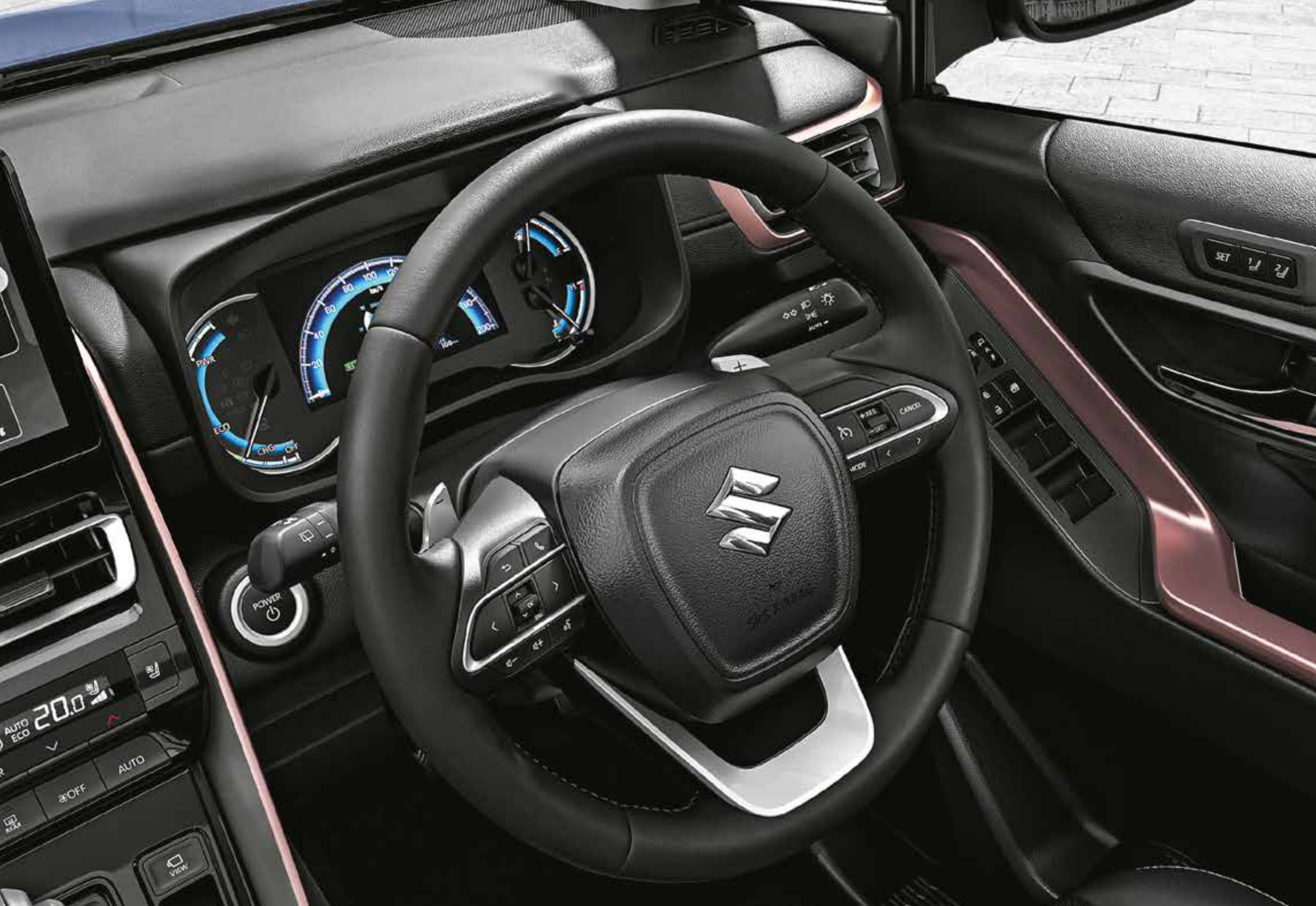 Maruti Suzuki Invicto — Digital-analogue instrument cluster with hybrid power/charge gauge, steering controls and push-button start.