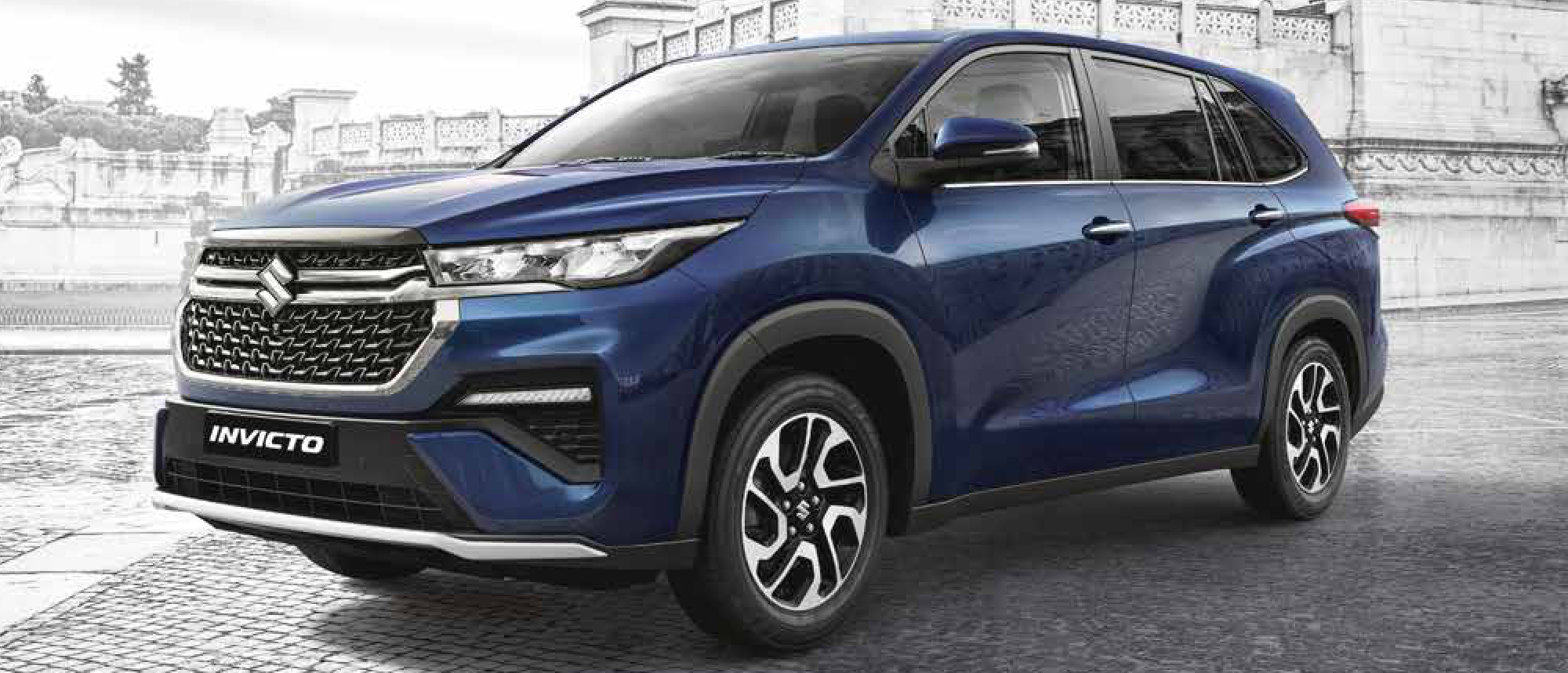 Maruti Suzuki Invicto — Front three-quarter stance showing the Twin LED headlamps, NEXTre DRLs and NEXWave chrome grille.
