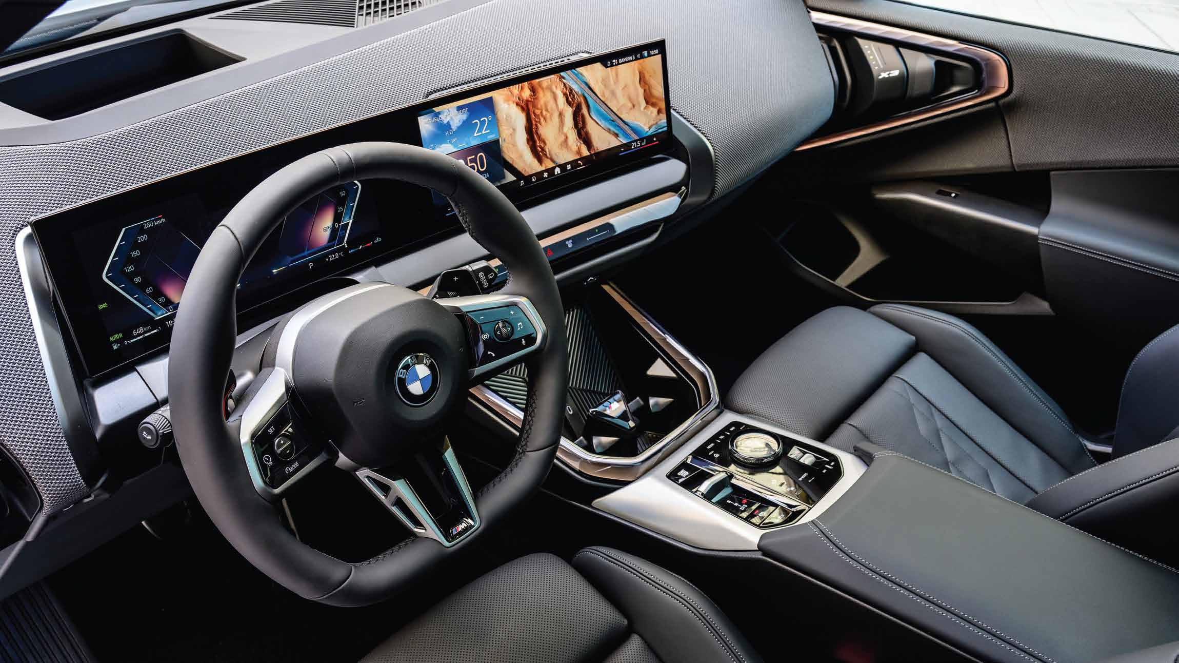 BMW X3 — Driver-oriented widescreen curved display running BMW Operating System 9