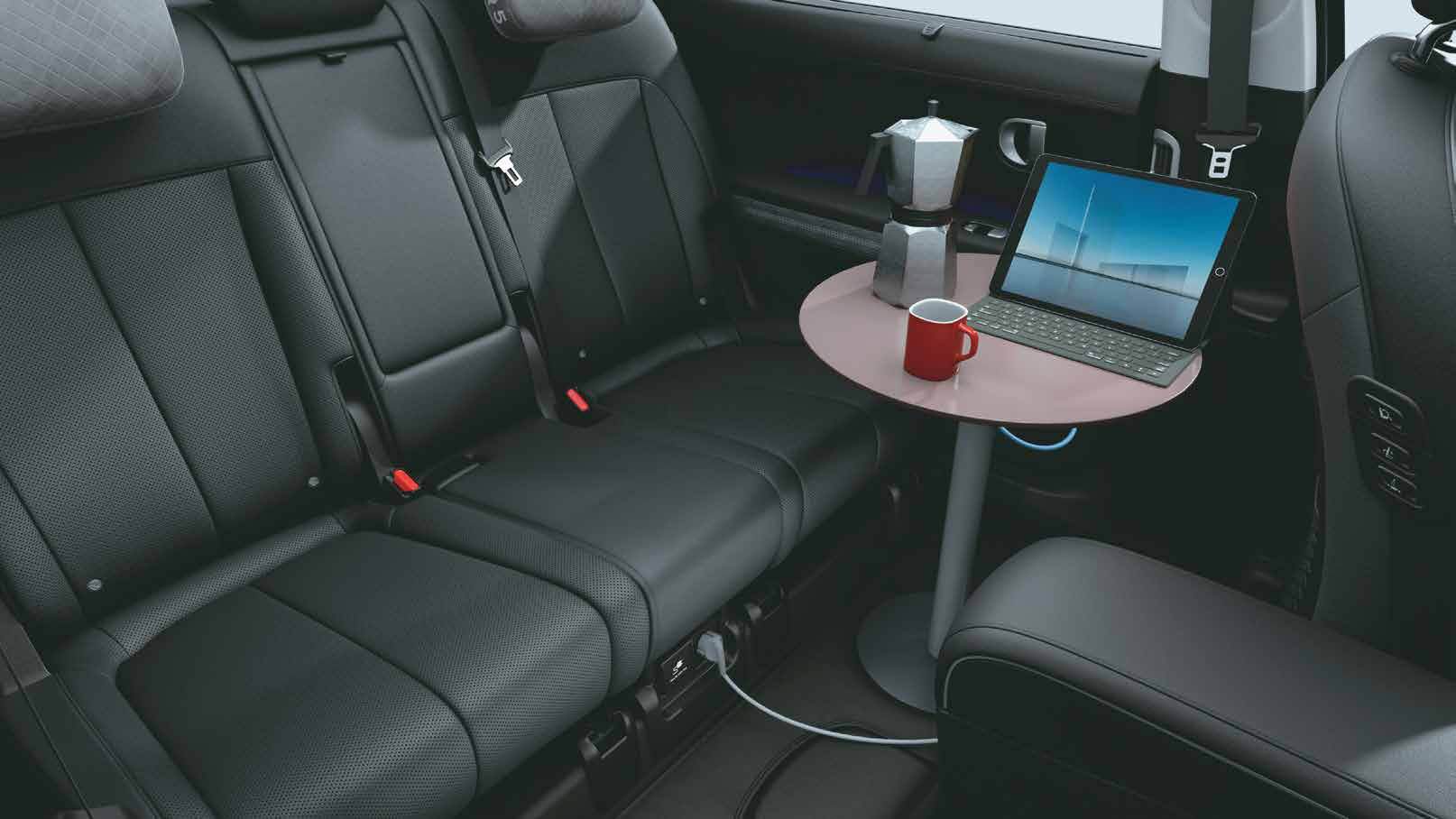 Hyundai Ioniq 5 — V2L (Vehicle-to-Load) inside: 3.6 kW power socket below the rear seat