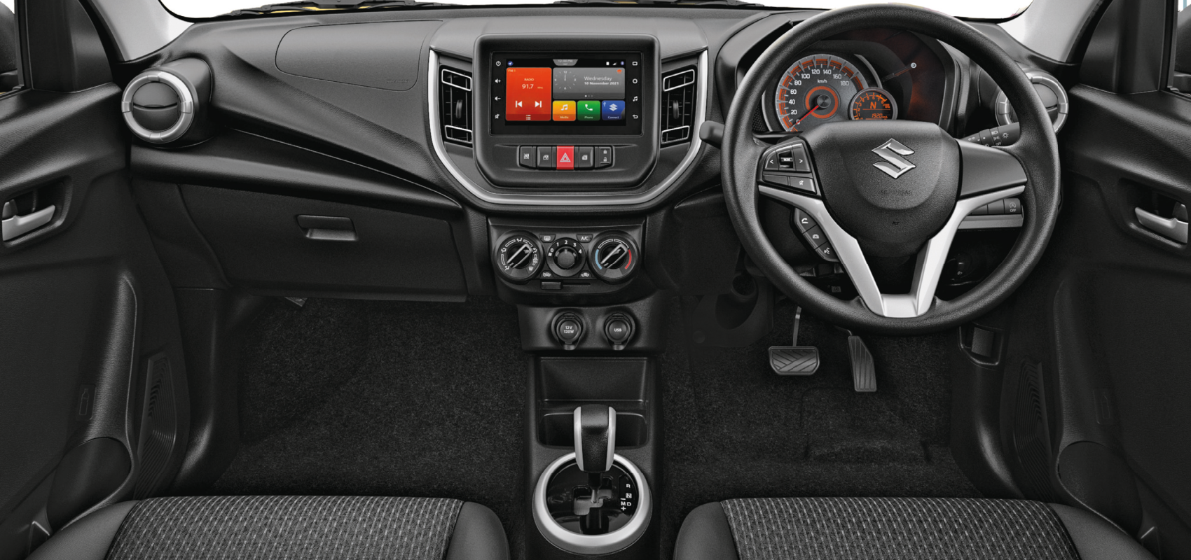Maruti Suzuki Celerio — All-black dashboard with floating touchscreen and rotary climate controls