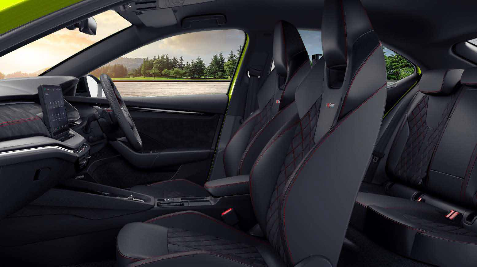 Skoda Octavia RS — RS sport seats in Suedia and leatherette with red diamond stitching and the RS logo.