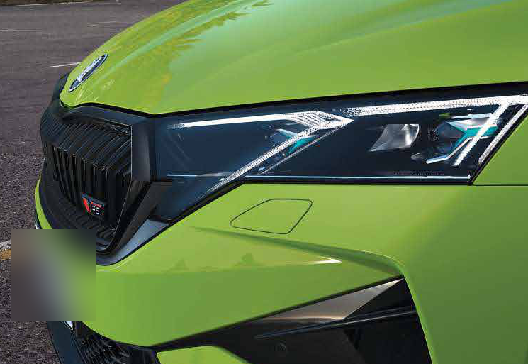Skoda Octavia RS — Full-LED Matrix headlight with crystalline detailing beside the gloss-black RS grille.