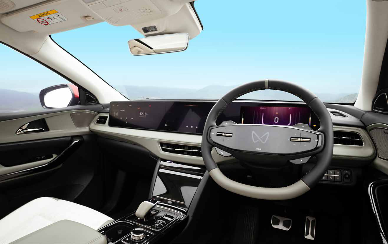 Mahindra XEV 9e — Two-spoke steering wheel with touch controls and an illuminated logo