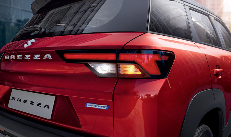 Maruti Suzuki Brezza (2022-2025) — LED tail lamps with connected-look signature and Smart Hybrid badge.