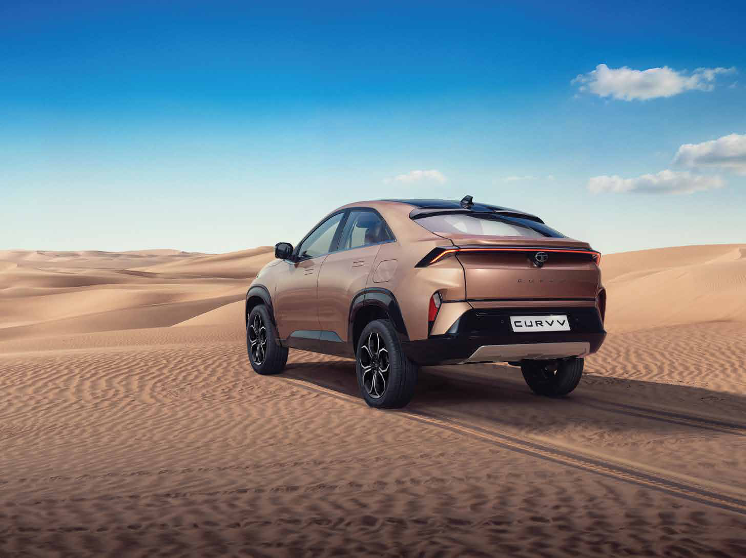Tata Curvv — Connected LED tail lamps run the full width of the tailgate, paired with sequential turn indicators.