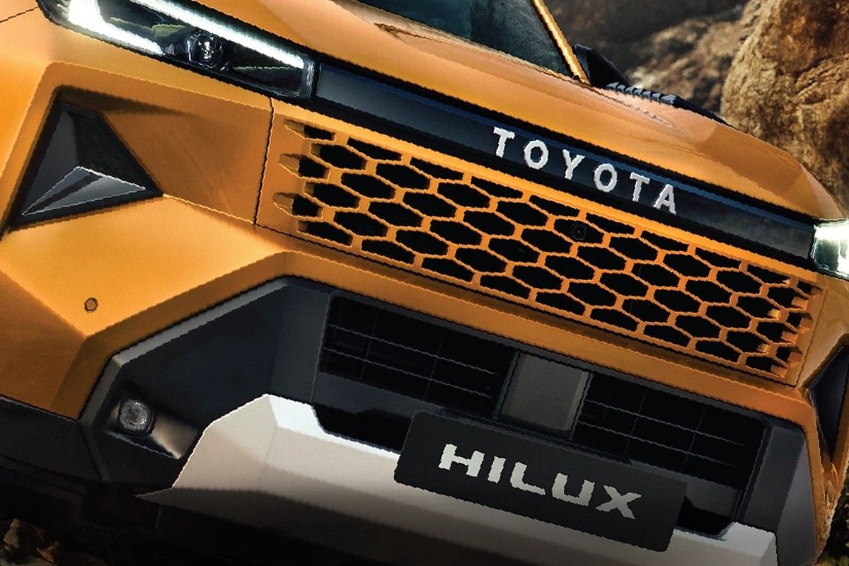 Toyota Hilux — Bold new hexagonal grille with C-shaped LED headlamps and daytime running lamps.