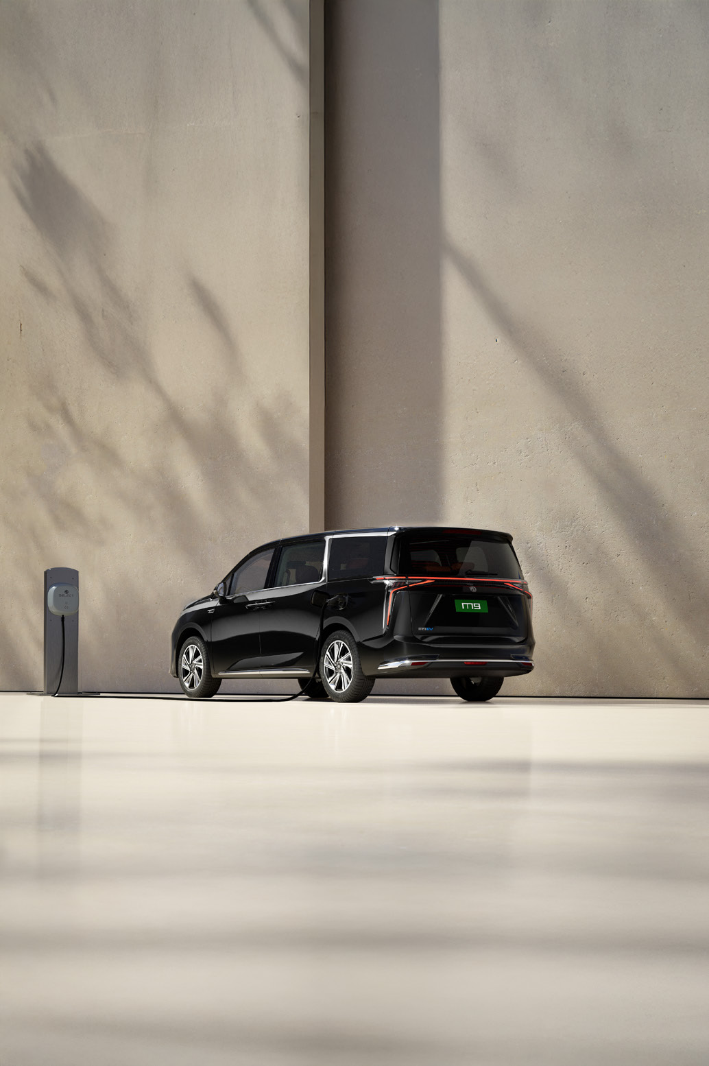 MG M9 — Home AC wall-box charging via the side charge port.