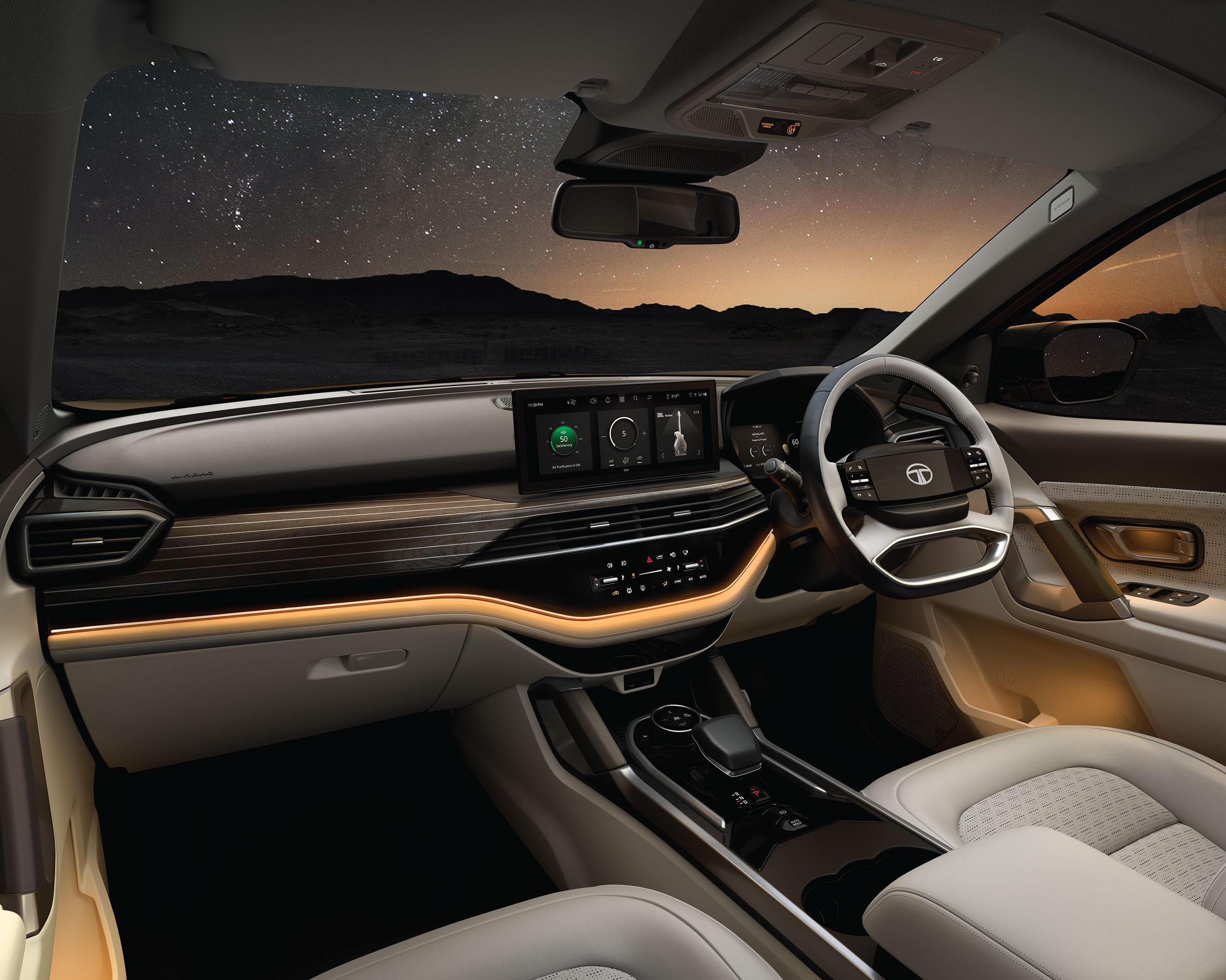 Tata Safari — Dual-tone premium cockpit with layered dashboard and wood-finish trim