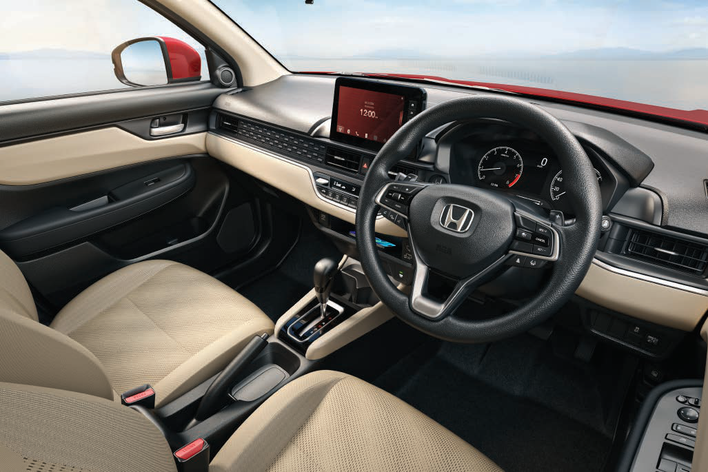 Honda Amaze — Beige-and-black two-tone cabin with leather-wrapped steering wheel, floating touchscreen and TFT meter