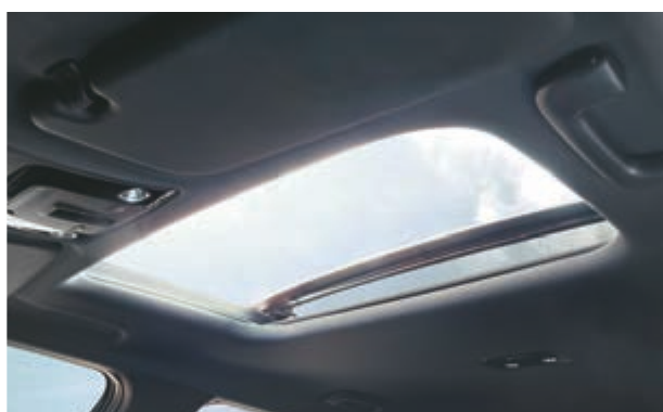 Kia EV6 — Wide electric sunroof opening the cabin to the sky.