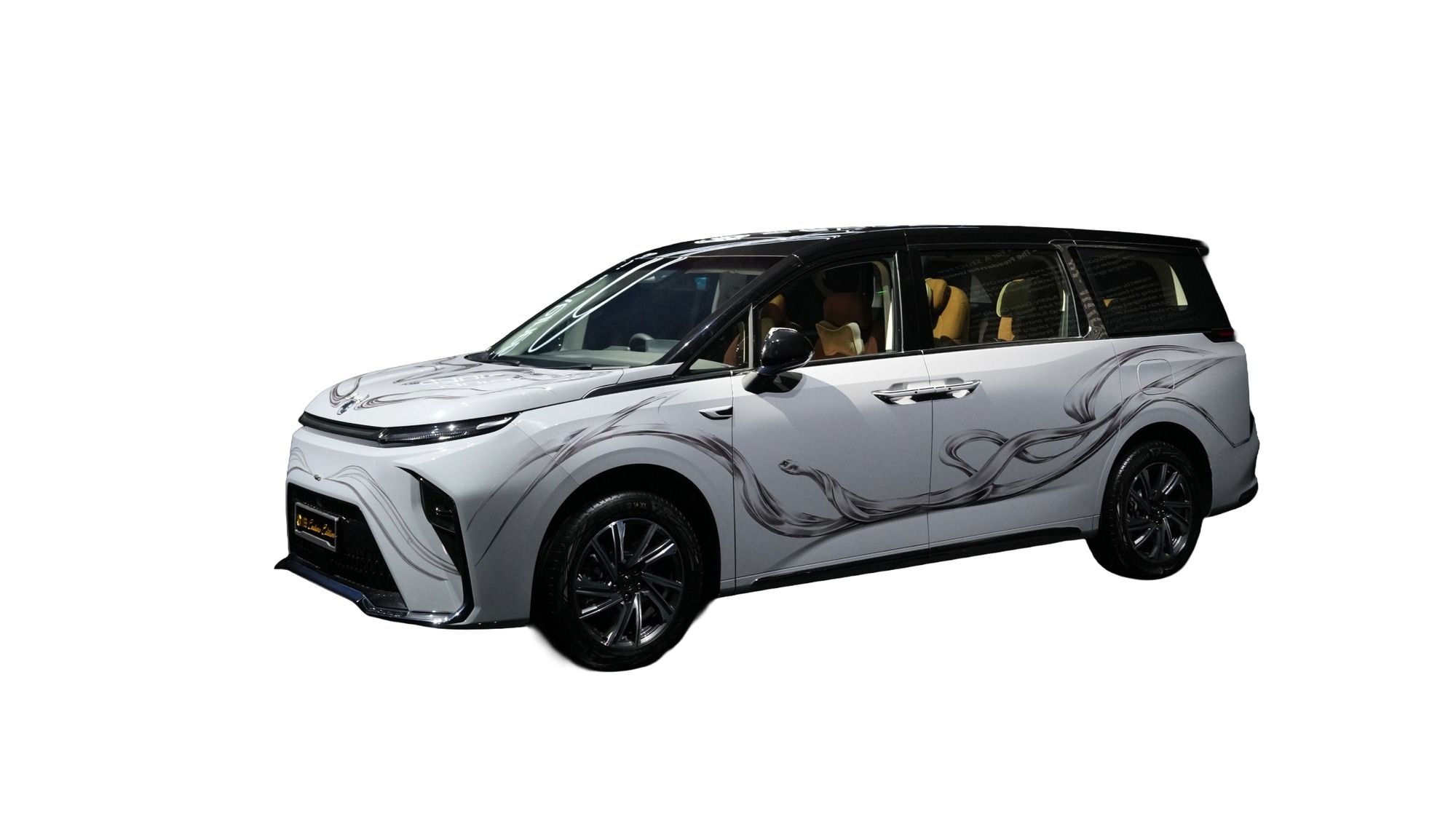 MG M9 — M9 Couture Edition — white body with charcoal 'Serpent Infinity' streaks, gold MG emblems and a 'Couture Edition' dashboard wordmark, designed with couturier Gaurav Gupta. Limited to 50 units at ₹84.94 lakh (ex-showroom), sold only through MG Select.