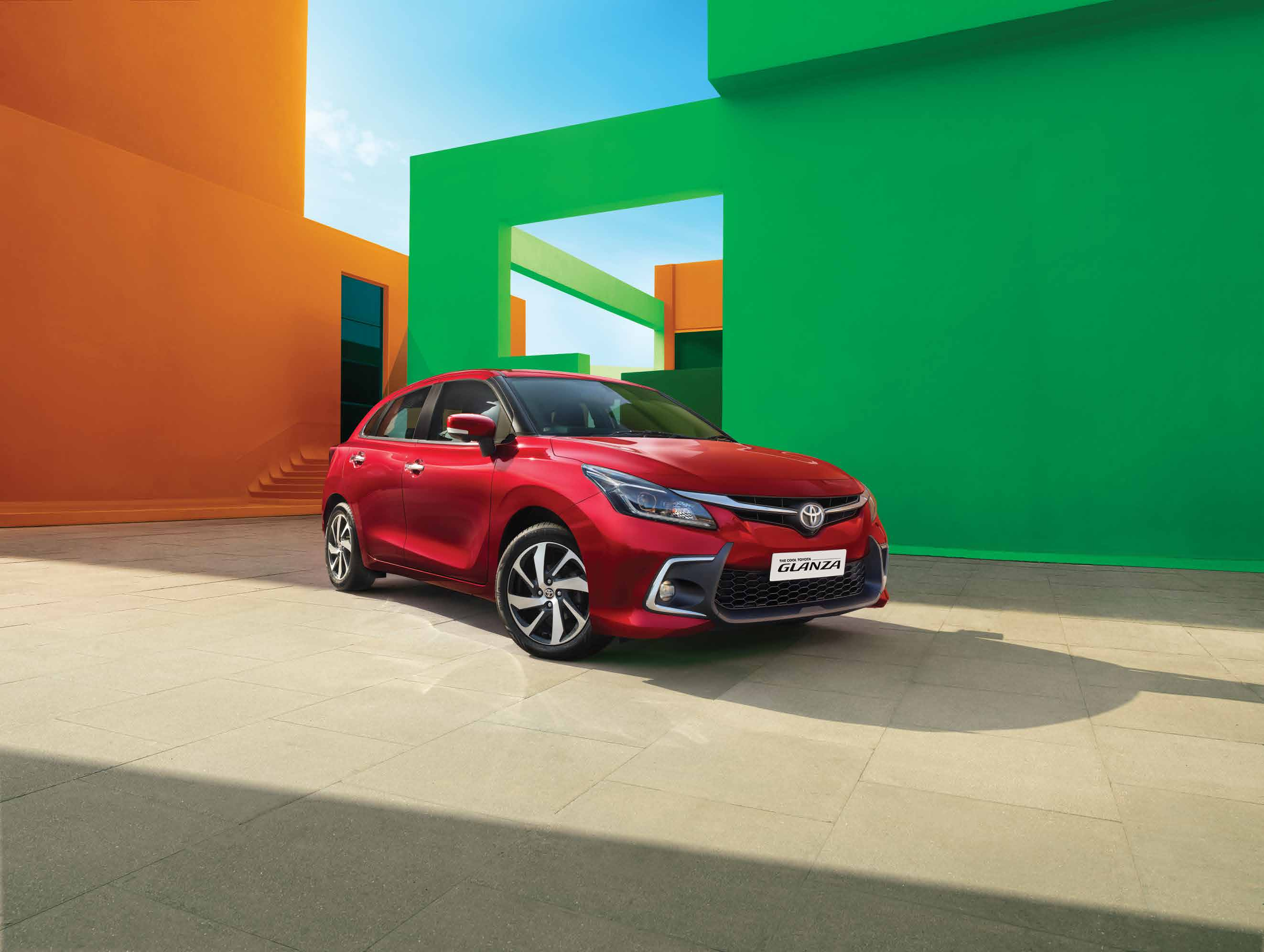 Toyota Glanza — Bold front fascia with the Toyota signature upper grille, LED projector headlamps and LED daytime running lights.