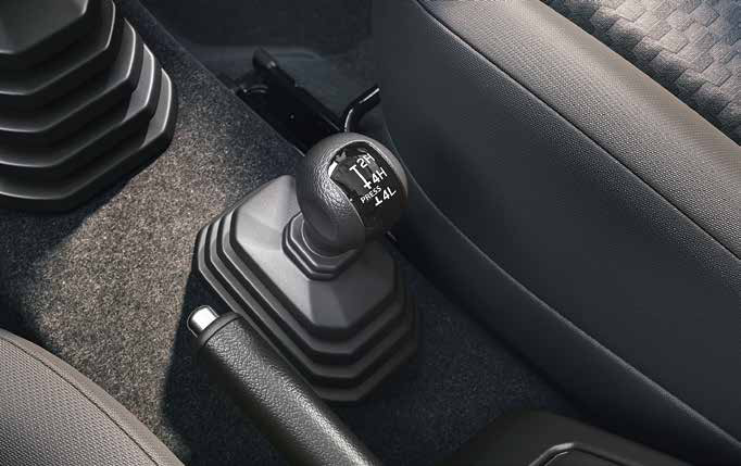 Maruti Suzuki Jimny — Dedicated transfer-case lever selects 2H, 4H and 4L low-range four-wheel drive.