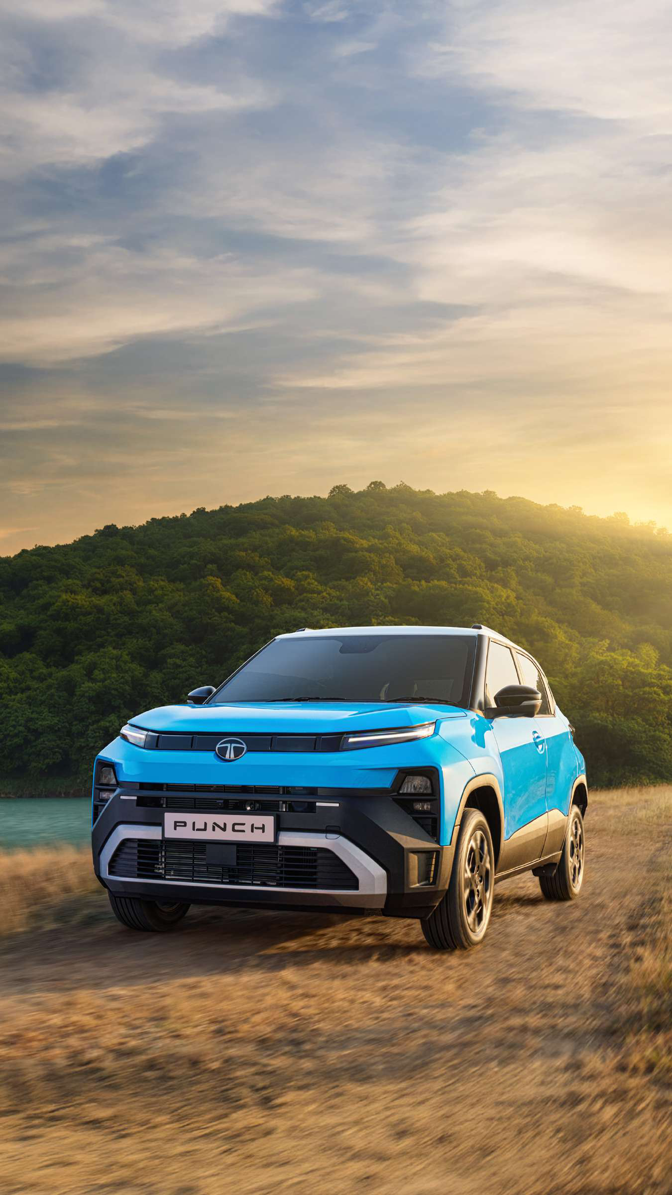 Tata Punch — Front three-quarter stance with dual-tone contrast roof, roof rails and rugged bumper cladding
