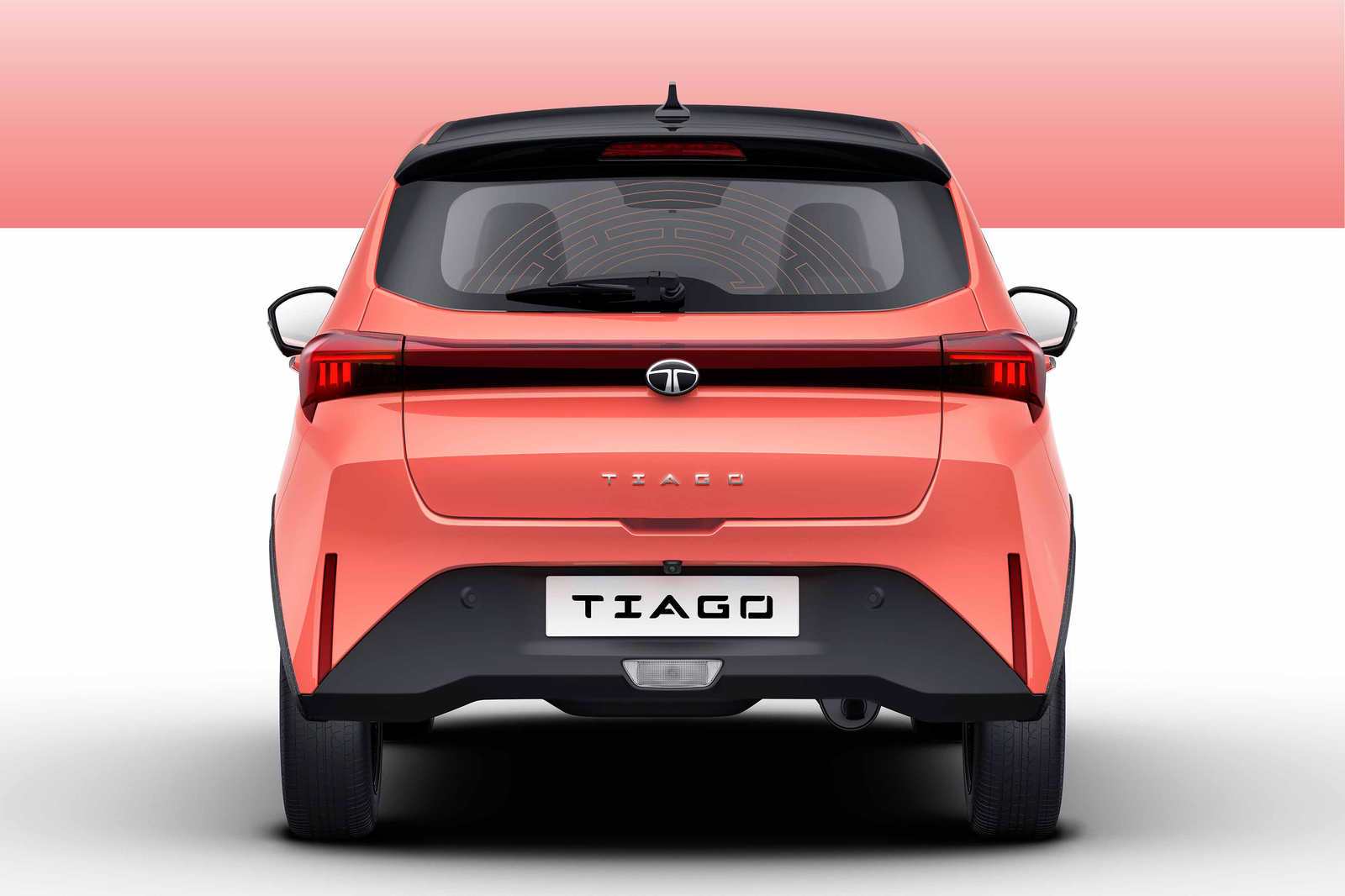 Tata Tiago — Halo lightbar connected tail lamps stretch edge to edge for a wide, planted rear signature