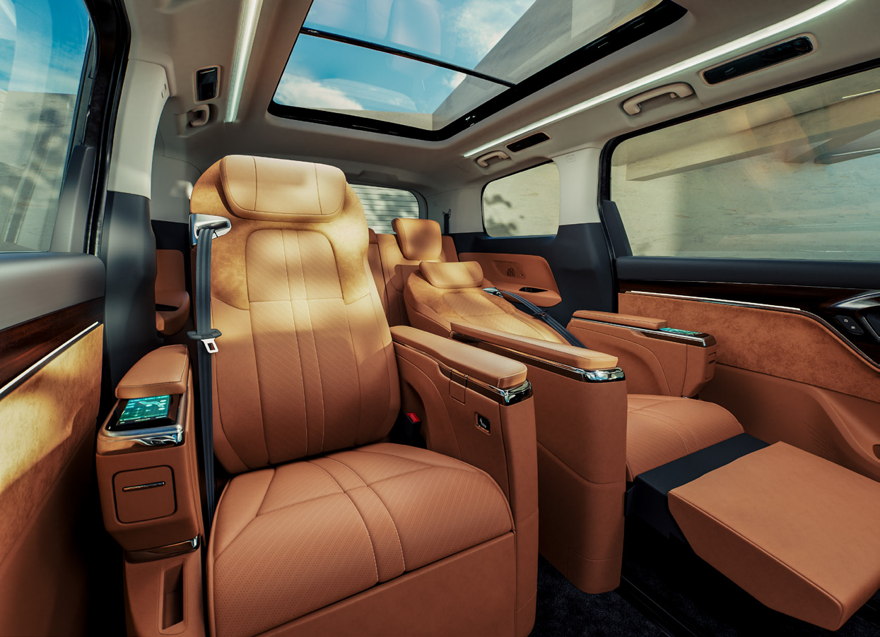 MG M9 — Second-row captain seat reclined with the powered leg-rest extended.
