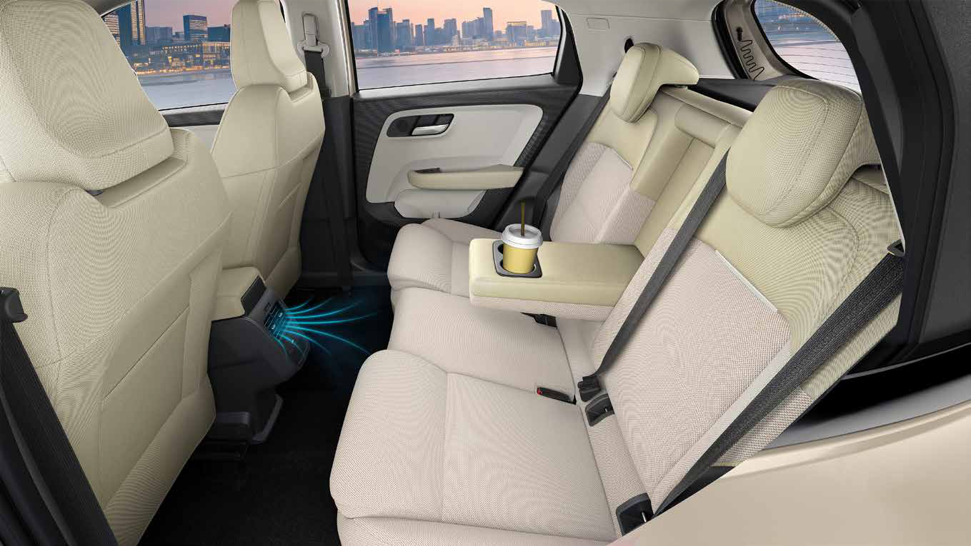 Tata Altroz — Rear AC vents plus a folding rear armrest with cupholders for second-row passengers