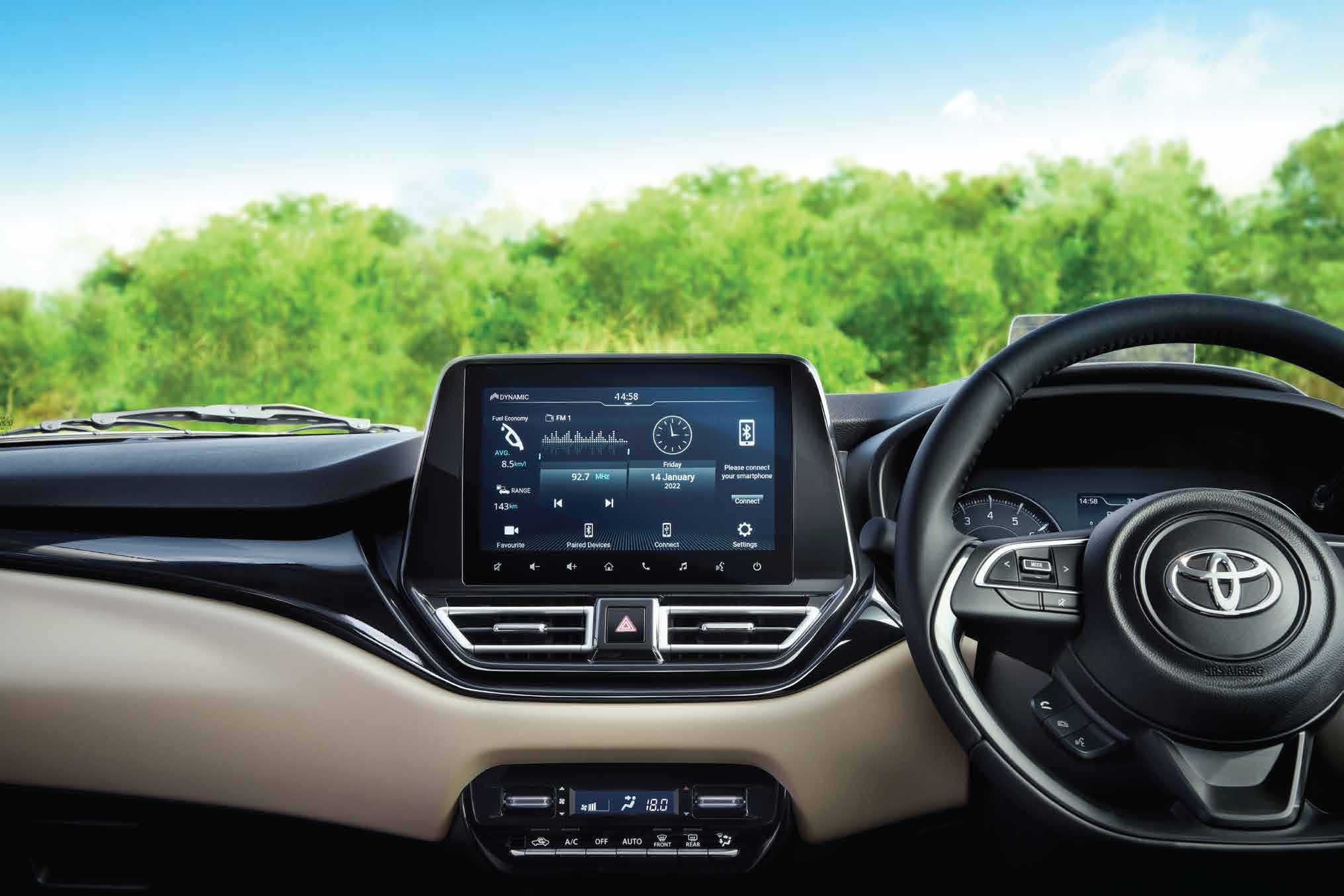 Toyota Glanza — Dual-tone cabin with a layered dashboard, 22.86 cm SmartPlayCast touchscreen and multi-function steering wheel.