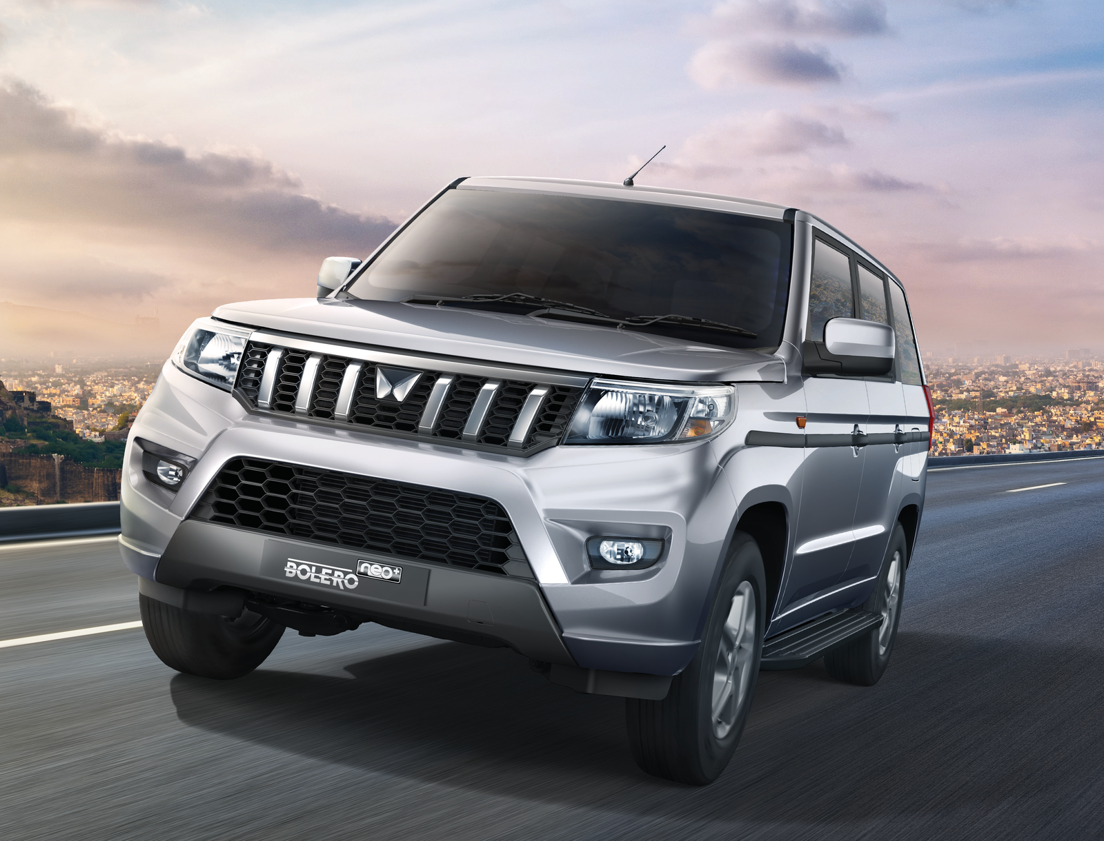 Mahindra Bolero Neo Plus — Mahindra Bolero Neo Plus 9-seater — front three-quarter view with signature grille and X-shaped bumper